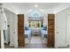 Unique bedroom features wood shutter doors, twin beds, and a charming window seat at 9 Intracoastal Ct, Isle of Palms, SC 29451