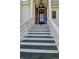 Close-up of front door showcasing architectural details and a welcoming entryway at 9 Intracoastal Ct, Isle of Palms, SC 29451