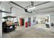 A spacious garage featuring ample storage space, a workbench, and a golf cart at 9 Intracoastal Ct, Isle of Palms, SC 29451