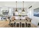 Bright kitchen features a large center island with seating, stainless steel appliances, and natural light at 9 Intracoastal Ct, Isle of Palms, SC 29451