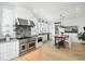 Bright and airy kitchen featuring stainless steel appliances, a center island, and hardwood floors at 9 Intracoastal Ct, Isle of Palms, SC 29451