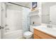 Bright bathroom with a shower-tub combo, white sink, and light wood vanity at 9118 Maple Grove Dr, Summerville, SC 29485
