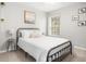 Stylish bedroom featuring a black metal frame bed and ample natural light at 9118 Maple Grove Dr, Summerville, SC 29485