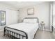 Bright bedroom with a black bed frame, soft carpet, and natural light from the window at 9118 Maple Grove Dr, Summerville, SC 29485