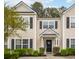 Charming townhome featuring a welcoming entrance, neutral siding, black shutters, and well-maintained landscaping at 9118 Maple Grove Dr, Summerville, SC 29485