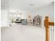 An open upstairs area with living space and bright natural light from windows at 9118 Maple Grove Dr, Summerville, SC 29485