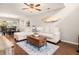 Inviting living room with hardwood floors, comfortable seating, a ceiling fan, and a view into the dining area at 9118 Maple Grove Dr, Summerville, SC 29485