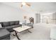 Spacious living room with carpet, natural light, and a comfortable seating area at 9118 Maple Grove Dr, Summerville, SC 29485