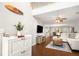 Bright, open living room featuring hardwood floors, modern furnishings, and stylish decor at 9118 Maple Grove Dr, Summerville, SC 29485