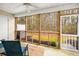 Relaxing screened porch with ceiling fan and a view of the private backyard at 9118 Maple Grove Dr, Summerville, SC 29485