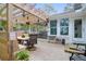 Sunny deck with a pergola, ample seating, and a view of the lush backyard; ideal for entertaining at 935 Lansing Dr, Mount Pleasant, SC 29464