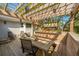 Outdoor deck featuring a pergola, dining area, and a cozy lounge area with cushioned seating at 935 Lansing Dr, Mount Pleasant, SC 29464