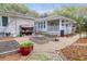 Charming backyard featuring gravel paths, raised garden beds, and a serene outdoor space for gardening enthusiasts at 935 Lansing Dr, Mount Pleasant, SC 29464
