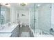 Bathroom with a glass enclosed shower, grey cabinets, and marble countertops at 935 Lansing Dr, Mount Pleasant, SC 29464