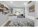 Multi-purpose room with Murphy bed, built-in shelves, desk, and bright natural light from large window at 935 Lansing Dr, Mount Pleasant, SC 29464