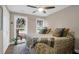 Sunlit bedroom featuring two beds with plush bedding, hardwood floors, and ample natural light at 935 Lansing Dr, Mount Pleasant, SC 29464