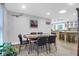 Charming dining area with an oval table, seating six, and bright, airy access to the kitchen at 935 Lansing Dr, Mount Pleasant, SC 29464