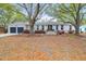 Charming brick home featuring a well-manicured front yard with mature trees at 935 Lansing Dr, Mount Pleasant, SC 29464