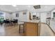 Open floor plan kitchen with an island, barstool seating, and access to dining and living spaces at 935 Lansing Dr, Mount Pleasant, SC 29464