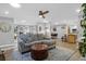 Open concept living room featuring modern furniture, natural light, and seamless flow to the kitchen and dining area at 935 Lansing Dr, Mount Pleasant, SC 29464