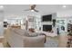 Inviting living room with a fireplace, hardwood floors, and seamless access to the kitchen and outdoor spaces at 935 Lansing Dr, Mount Pleasant, SC 29464