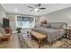 Main bedroom featuring a patterned bedspread, a large window, and wood floors at 935 Lansing Dr, Mount Pleasant, SC 29464