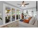 Bright sunroom with sliding glass doors leading to the deck, plants, and comfortable seating at 935 Lansing Dr, Mount Pleasant, SC 29464