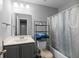 Bathroom featuring a mirror and a shower with a curtain at 9727 Transplanter Cir, Ladson, SC 29456