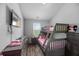Bedroom featuring a bunk bed, tv, and wood-look flooring at 9727 Transplanter Cir, Ladson, SC 29456