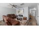 Comfortable living room featuring a modern fireplace and ceiling fan, perfect for relaxing at 9727 Transplanter Cir, Ladson, SC 29456