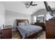Vaulted main bedroom with a fan and a TV mounted on the wall at 9727 Transplanter Cir, Ladson, SC 29456
