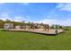 Spacious playground with modern equipment, surrounded by green grass, perfect for Gathering fun at 9727 Transplanter Cir, Ladson, SC 29456