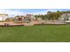 Community playground with swings, slides, and play structures in a Gathering-friendly neighborhood at 9727 Transplanter Cir, Ladson, SC 29456