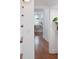 Hallway view leading to a bright, open kitchen with bar seating and modern finishes at 10 Killians St, Charleston, SC 29403