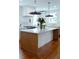 Bright kitchen featuring an island, stainless steel appliances, pendant lighting, and hardwood floors at 10 Killians St, Charleston, SC 29403