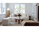 Bright living room with a modern sofa, stylish decor, and plenty of natural light at 10 Killians St, Charleston, SC 29403