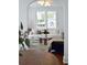 Inviting living room with neutral furniture, a round wood coffee table, and an arched entryway at 10 Killians St, Charleston, SC 29403