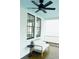 Inviting porch with a comfortable seating area, ceiling fan, and views of the neighborhood at 10 Killians St, Charleston, SC 29403