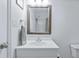 Bathroom with white vanity, framed mirror, and towel ring presents a clean and functional design at 1003 Mountain Pine Rd, Moncks Corner, SC 29461