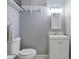 Clean bathroom featuring a toilet, modern vanity, and storage shelves at 1003 Mountain Pine Rd, Moncks Corner, SC 29461