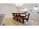 Bright dining room with a large wood table, seating for six, and an open layout at 1003 Mountain Pine Rd, Moncks Corner, SC 29461