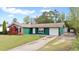 Inviting single-story home with a mix of brick and siding, a neat front lawn, and an attached one-car garage at 1003 Mountain Pine Rd, Moncks Corner, SC 29461