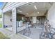 Large detached garage with an open door, showcasing ample storage space and potential for a workshop area at 1003 Mountain Pine Rd, Moncks Corner, SC 29461