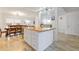 Open kitchen and dining area with a butcher block island, laminate floors, and abundant natural light at 1003 Mountain Pine Rd, Moncks Corner, SC 29461