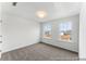 Cozy bedroom features a neutral color palette, two windows, a door and new carpet at 1005 Toland Dr # 44P, Saint George, SC 29477
