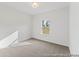 This is a bedroom featuring neutral carpet, light fixture and window at 1005 Toland Dr # 44P, Saint George, SC 29477