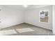 This is a bedroom featuring neutral carpet, light fixture and window at 1005 Toland Dr # 44P, Saint George, SC 29477