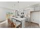 Modern kitchen featuring gray cabinets, quartz countertops, an island with seating, and stainless steel appliances at 1005 Toland Dr # 44P, Saint George, SC 29477