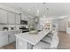 Modern kitchen with gray cabinets, an island with seating, stainless steel appliances, and pendant lighting at 1005 Toland Dr # 44P, Saint George, SC 29477