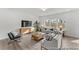 Bright living room featuring comfortable seating, a modern TV stand, natural light, and a decorative rug at 1005 Toland Dr # 44P, Saint George, SC 29477